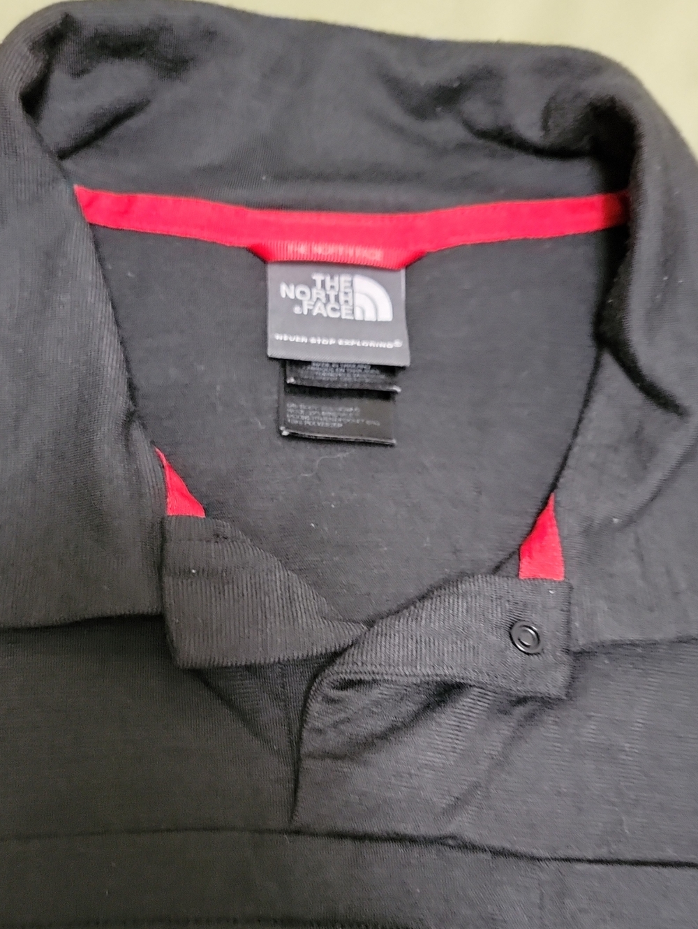 The North Face Black Polo with Red Trim Interior